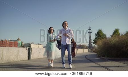 A Young Couple Dancing A Spanish Dance To Live Music. Young Couple Dancing Outdoors Under The Button