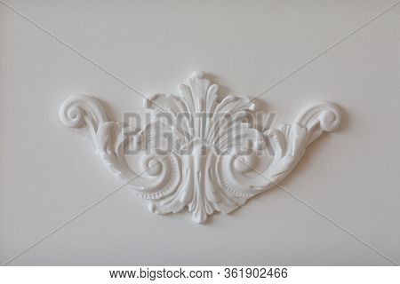 Expensive Interior. Stucco Elements On Light Luxury Wall. White Patterned. Mouldings Element From Gy