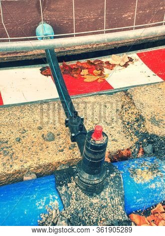 Drink Water Delivering In Steel And Pvc Plastic Pipes Underground. Construction Site Marked With Whi