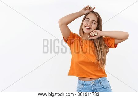 Summetime, Weekends And Leisure Fun Concept. Portrait Of Chill Blond Girl Vibing, Enjoying Music At 