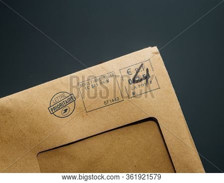 Paris, France - Feb, 25, 2020: Male Hand Holding French Paper Envelope Lettre Prioritaire Priority F
