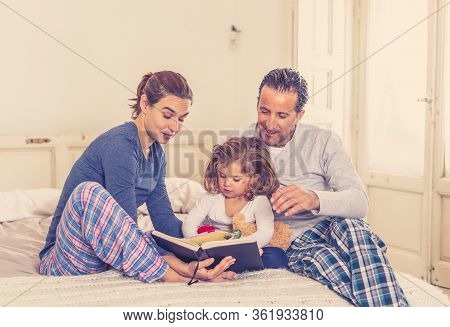 Covid-19 Outbreak. Stay At Home, Stop The Spread. Happy Family Father, Mother And Cute Daughter Todd