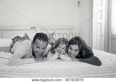 Covid-19 Quarantine. Happy Loving Family Lying In Bed Staying At Home During Coronavirus Outbreak