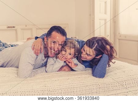 Covid-19 Quarantine. Happy Loving Family Lying In Bed Staying At Home During Coronavirus Outbreak