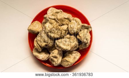 Pile Of Raw Asam Boi Or Sour Plum On Red Bowl On White Background.