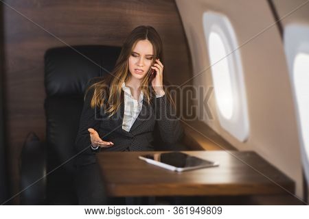 Attractive Woman In Private Jet