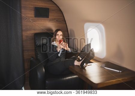 Attractive Woman In Private Jet