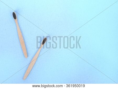 Zero Waste Concept. Bamboo Toothbrushes On A White-blue Background