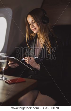 Attractive Woman In Private Jet