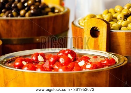 Red Small Peppers Stuffed With Feta Cream Cheese And Olives For Sale At Outdoors Food Market.