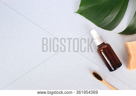 The Concept Of Zero Waste. Bamboo Toothbrush, Solid Shampoo And Serum
