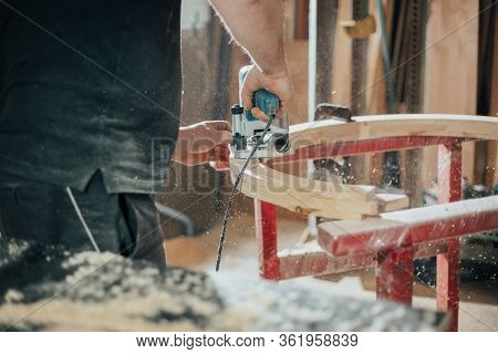 Joinery, Woodworking And Furniture Making, Professional Carpenter Cutting Wood In Carpentry Shop, In