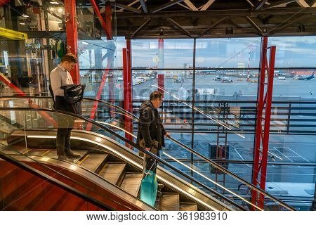 Moscow, Russia - 2020: Sheremetyevo International Airport, Passengers Descending On An Escalator.