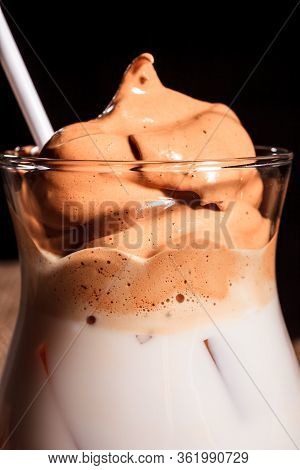 Iced Korean Dalgona Coffee, A Trendy Fluffy Creamy Whipped Coffee With White Tube And Ice. Trendy Co