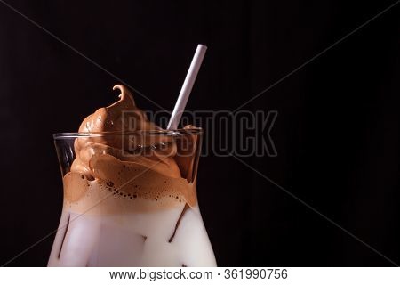 Cold Trendy Drink Korean Dalgon Iced Coffee On Dark Background. Delicious And Popular Coffee In The