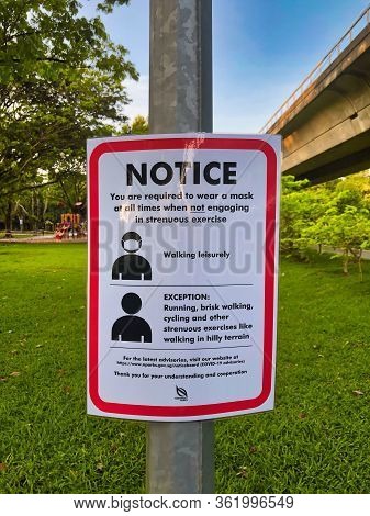 Singapore-18 Apr 2020: A Notice Put Up By The Singapore Authority To Remind Public To Wear A Mask At