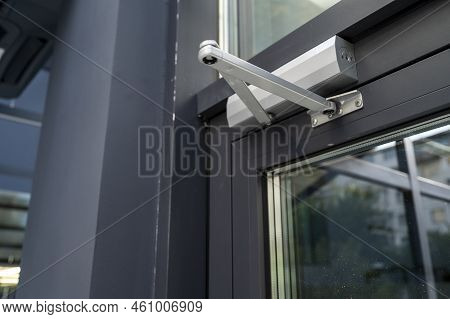 External Open Closer On A Glass Door In The Interior, A Device For Controlling The Process Of Dampin
