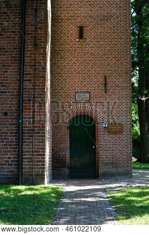 Peize, Groningen, The Netherlands - 07 20 2022 - Brick Stone Wall With Inscription Of The Local Calv