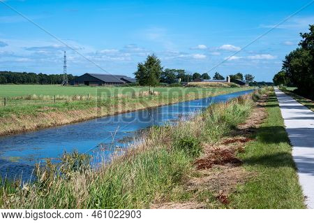 Creek Through Green Wetlands Over Blue Sky At The Oostervoorts Diep National Park, The Netherlands