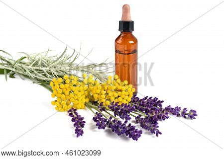 Lavender And Helichrysum Flowers With Bottle Isolated On White Background