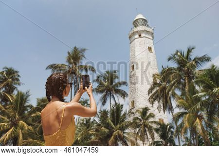 Romantic Woman Traveler In Dress Taking Photo On Smartphone Of Famous Landmarks Of Sri Lanka Country