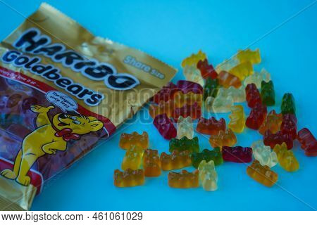 Pskov, Rusia - August 09, 2022: A Package Of Sweet Haribo Chewing Bears On A Blue Background. Top Vi