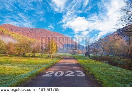 Road 2023. The Road Leads To The Autumn Forest In The Tuman Mountains. Beginning In 2023