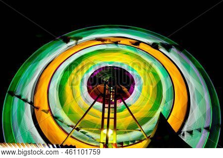 Ferris Wheel At Night Festival In Slow Motion Photo. High Roller
