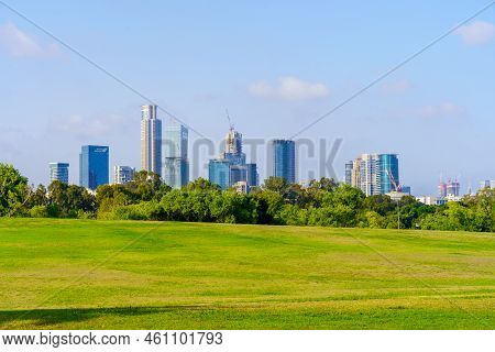 Tel-aviv, Israel - June 17, 2022: View Of Lawns, Trees, And Office Buildings In The Background, In T
