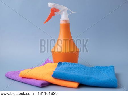 On A Blue Background, There Are Microfiber Cleaning Cloths Of Different Colors Laid Out On The Back 