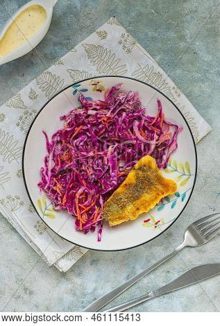 Grilled Fish With Red Cabbage And Carrot Colslow Salad With Mayonnaise Dressing In A White Bowl On A