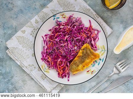 Grilled Fish With Red Cabbage And Carrot Colslow Salad With Mayonnaise Dressing In A White Bowl On A
