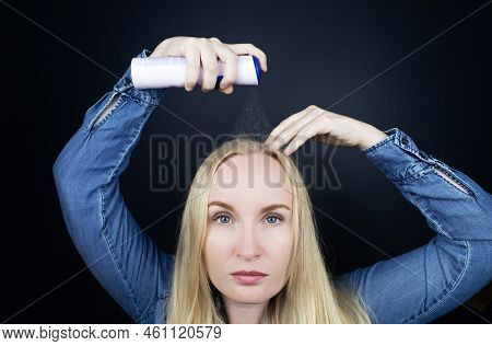 Dry Shampoo. Blonde Girl Sprays Shampoo On Her Hair. The Problem Of Oily Hair While Traveling. An Em