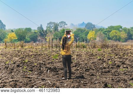 Female Farmer Use Tablet To Take Wide Angle Shots Of Land To Make Farming Decisions In Soil Field. W