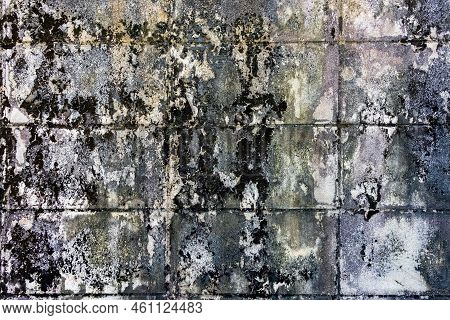 Dirty Old Eroded Cracked Plaster Cement Block Fence. Concrete Block Wall. Destroyed Crumbling Cement