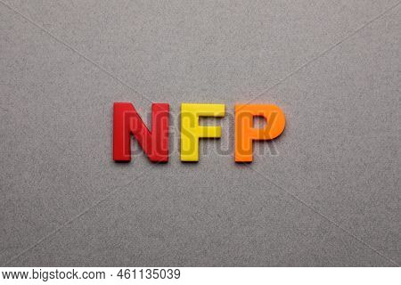 Abbreviation Nfp (nonfarm Payroll) Made Of Letters On Grey Background, Top View