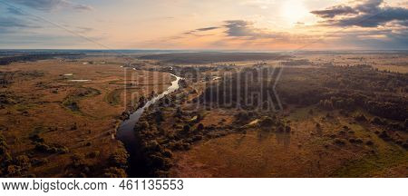Wide Panorama Of Small River In The Countryside In The Morning With Rising Sun On The Background. Su