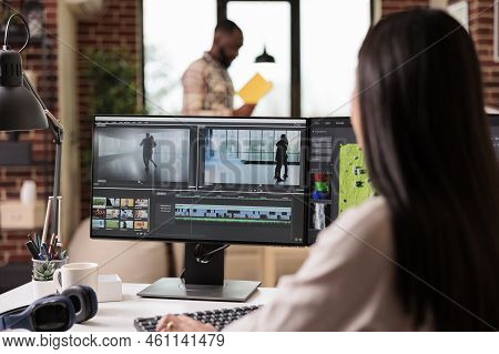 Professional Editor Using Montage To Edit Film In Multimedia Software For Post Production. Editing M