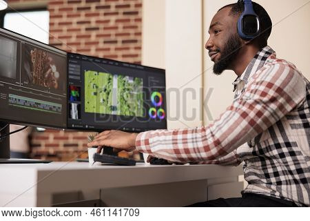 Professional Creator Using Software To Edit Video Footage On Multiple Monitors At Home, Editing Movi
