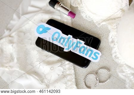 Ternopil, Ukraine - September 6, 2022 Onlyfans Paper Logotype Among Lipstick, Earrings And Women Lin