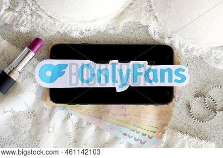Ternopil, Ukraine - September 6, 2022 Onlyfans Paper Logotype Among Lipstick, Earrings And Women Lin