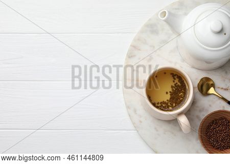 Freshly Made Buckwheat Tea Served On White Wooden Table, Top View. Space For Text