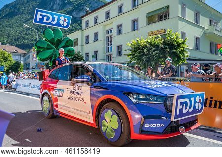 Aigle, Valais Canton, Switzerland -july 10, 2022: Passage Of An Advertising Car Of Groupama Fdj In T