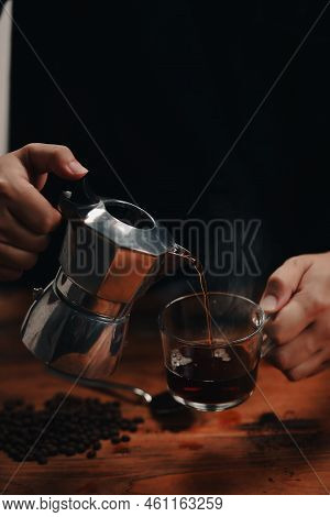 Close Up View Barista Pouring Fresh Coffee From Moka Pot.