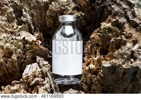 Antivenom Bottle On A Wooden Base. Glass Bottle With Antidote.