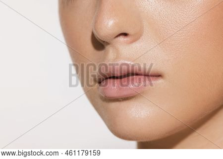 Closeup Female Lips, Cheeks And Nose Isolated Over White Studio Background. Concept Of Cosmetology, 