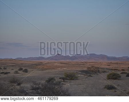 Sunset Over The Arid Landscape Of The Kaokoveld Near The Skeleton Coast In Namibia Africa
