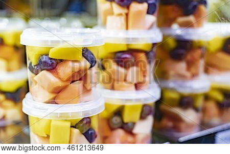 Pre-packaged Fruit Salads Displayed In A Commercial Refrigerator