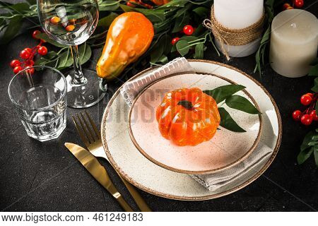 Autumn Table Setting With Plate, Pumpkin And Candles. Thanksgiving Food Festive Dinner Concept.