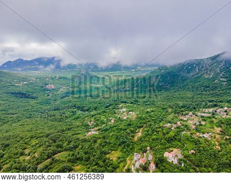 Beautiful View Of The Mountains Of Montenegro And Skadar Lake Portrait Of A Disgruntled Girl Sitting